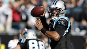 Jan 12, 2014; Charlotte, NC, USA; Carolina Panthers quarterback Cam Newton (1) looks to pass against the San Francisco 49ers during the first quarter of the 2013 NFC divisional playoff football game at Bank of America Stadium. Mandatory Credit: Jeremy Brevard-USA TODAY Sports