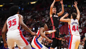 Miami Heat forward Nikola Jovic (5) passes the ball away from Detroit Pistons forward Bojan Bogdanovic Credit: Jasen Vinlove-USA TODAY Sports