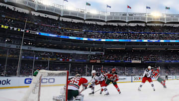 Travis Zajac #19 of the New Jersey Devils receives a penalty for holding Derek Stepan #21 of the New York Rangers (Photo by Al Bello/Getty Images)