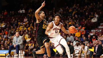 Jan 16, 2023; Minneapolis, Minnesota, USA; Illinois Fighting Illini guard Terrence Shannon Jr. (0) drives to the basket while Minnesota Golden Gophers guard Ta'lon Cooper (55) defends during the second half at Williams Arena. Mandatory Credit: Matt Krohn-USA TODAY Sports