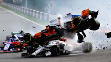 SPA, BELGIUM - AUGUST 26: Fernando Alonso of Spain driving the (14) McLaren F1 Team MCL33 Renault launches over the top of Charles Leclerc of Monaco driving the (16) Alfa Romeo Sauber F1 Team C37 Ferrari at the start during the Formula One Grand Prix of Belgium at Circuit de Spa-Francorchamps on August 26, 2018 in Spa, Belgium. (Photo by Mark Thompson/Getty Images)