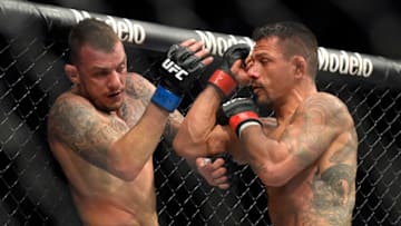 LAS VEGAS, NEVADA - MARCH 05: Rafael Dos Anjos (R) of Brazil and Rafael Fiziev of Kazakhstan battle in their lightweight fight during UFC 272 at T-Mobile Arena on March 05, 2022 in Las Vegas, Nevada. (Photo by David Becker/Getty Images)