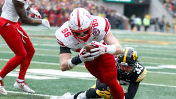 IOWA CITY, IOWA- NOVEMBER 23: Tight end Jack Stoll #86 of the Nebraska Cornhuskers dives for a touchdown in the first half in front of defensive back Riley Moss #33 of the Iowa Hawkeyes, on November 23, 2018 at Kinnick Stadium, in Iowa City, Iowa. (Photo by Matthew Holst/Getty Images)