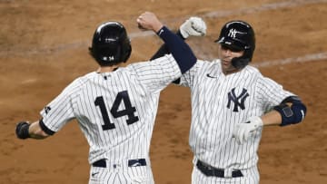 NEW YORK, NEW YORK - SEPTEMBER 16: Kyle Higashioka #66 of the New York Yankees celebrates with Tyler Wade #14 after Higashioka hit a two-run home run during the third inning against the Toronto Blue Jays at Yankee Stadium on September 16, 2020 in the Bronx borough of New York City. (Photo by Sarah Stier/Getty Images)