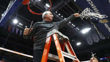Mar 13, 2022; Tampa, FL, USA; Tennessee Volunteers head coach Rick Barnes cuts down the net after defeating the Texas A&M Aggies at Amalie Arena. Mandatory Credit: Kim Klement-USA TODAY Sports