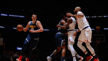 DENVER, CO - DECEMBER 15: Nikola Jokic #15 of the Denver Nuggets handles the ball against the New York Knicks on December 15, 2019 at the Pepsi Center in Denver, Colorado. NOTE TO USER: User expressly acknowledges and agrees that, by downloading and/or using this Photograph, user is consenting to the terms and conditions of the Getty Images License Agreement. Mandatory Copyright Notice: Copyright 2019 NBAE (Photo by Bart Young/NBAE via Getty Images)