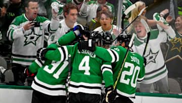 Apr 19, 2023; Dallas, Texas, USA; Dallas Stars center Roope Hintz (24) and center Tyler Seguin (91) and defenseman Miro Heiskanen (4) and defenseman Ryan Suter (20) celebrates after Hintz scores his second goal against Minnesota Wild goaltender Marc-Andre Fleury (not pictured) during the second period in game two of the first round of the 2023 Stanley Cup Playoffs at American Airlines Center. Mandatory Credit: Jerome Miron-USA TODAY Sports