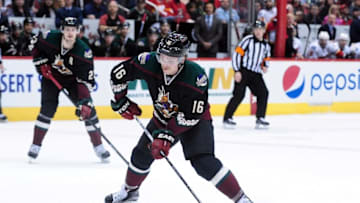 Nov 27, 2015; Glendale, AZ, USA; Arizona Coyotes center Max Domi (16) carries the puck during overtime against the Calgary Flames at Gila River Arena. Mandatory Credit: Matt Kartozian-USA TODAY Sports