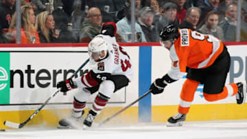 PHILADELPHIA, PA - DECEMBER 05: Michael Grabner #40 of the Arizona Coyotes skates the puck along the boards against Ivan Provorov #9 of the Philadelphia Flyers on December 5, 2019 at the Wells Fargo Center in Philadelphia, Pennsylvania. (Photo by Len Redkoles/NHLI via Getty Images)