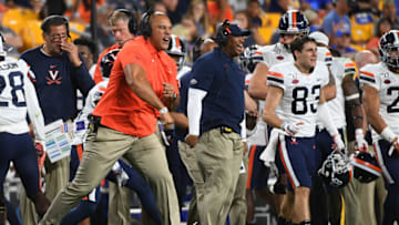 PITTSBURGH, PA - AUGUST 31: Defensive line coach Vic So'oto of the Virginia Cavaliers reacts after a defensive stop in the second half during the game against the Pittsburgh Panthers at Heinz Field on August 31, 2019 in Pittsburgh, Pennsylvania. (Photo by Justin Berl/Getty Images)