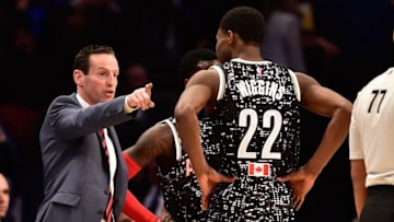 Feb 13, 2015; New York, NY, USA; World Team head coach Kenny Atkinson of the Atlanta Hawks (left) instructs World Team guard Andrew Wiggins of the Minnesota Timberwolves (22) during the second half against the U.S. Team at Barclays Center. Mandatory Credit: Bob Donnan-USA TODAY Sports