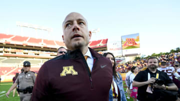 Jan 1, 2020; Tampa, Florida, USA; Minnesota Golden Gophers head coach PJ Fleck (yellow tie) walks on the field after defeating the Auburn Tigers at Raymond James Stadium. Mandatory Credit: Douglas DeFelice-USA TODAY Sports