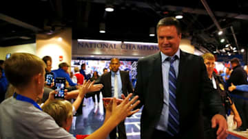 LAWRENCE, KS - NOVEMBER 29: Head coach Bill Self of the Kansas Jayhawks high-fives kids as he walks off the court following the game against the Long Beach State 49ers at Allen Fieldhouse on November 29, 2016 in Lawrence, Kansas. (Photo by Jamie Squire/Getty Images)