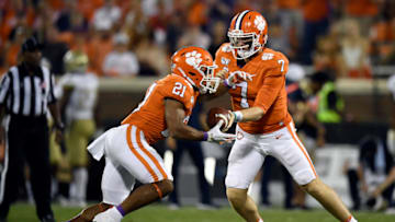 Duke football transfer quarterback hands the ball off for the Clemson Tigers in 2019.