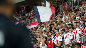 ZAPOPAN, MEXICO - FEBRUARY 04: Fans of Chivas cheer for their team in the stands during the fifth round match between Chivas and Veracruz as part of the Torneo Clausura 2019 Liga MX at Akron Stadium on February 4, 2019 in Zapopan, Mexico. (Photo by Refugio Ruiz/Getty Images)