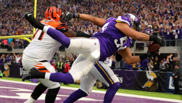 MINNEAPOLIS, MN - DECEMBER 17: Eric Kendricks #54 of the Minnesota Vikings dives with the ball for a touchdown after intercepting Andy Dalton #14 of the Cincinnati Bengals in the first quarter of the game on December 17, 2017 at U.S. Bank Stadium in Minneapolis, Minnesota. (Photo by Adam Bettcher/Getty Images)
