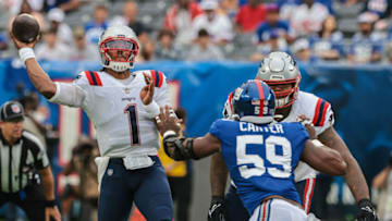 Auburn footballAug 29, 2021; East Rutherford, New Jersey, USA; New England Patriots quarterback Cam Newton (1) throws the ball during the first quarter as New York Giants linebacker Lorenzo Carter (59) pass rushes at MetLife Stadium. Mandatory Credit: Vincent Carchietta-USA TODAY Sports