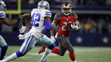 Dec 18, 2016; Arlington, TX, USA; Tampa Bay Buccaneers running back Doug Martin (22) runs the ball against Dallas Cowboys strong safety Barry Church (42) in the first quarter at AT&T Stadium. Mandatory Credit: Tim Heitman-USA TODAY Sports