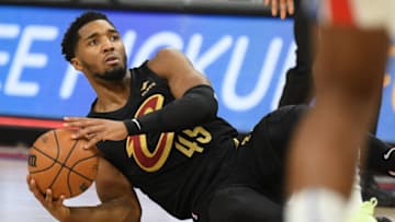 Nov 27, 2022; Detroit, Michigan, USA; Cleveland Cavaliers guard Donovan Mitchell scrambles for a loose ball against the Detroit Pistons in the first quarter at Little Caesars Arena. Mandatory Credit: Lon Horwedel-USA TODAY Sports