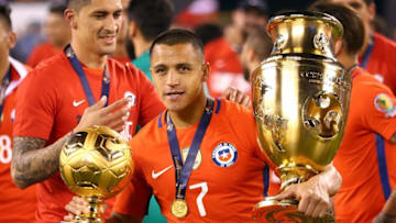 Jun 26, 2016; East Rutherford, NJ, USA; Chile forward Alexis Sanchez (7) holds his golden ball trophy and the Copa American championship trophy after beating Argentina in the championship match of the 2016 Copa America Centenario soccer tournament at MetLife Stadium. Chile defeated Argentina 0-0 (4-2). Mandatory Credit: Brad Penner-USA TODAY Sports