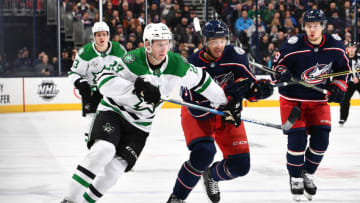 COLUMBUS, OH - JANUARY 18: Esa Lindell #23 of the Dallas Stars and Seth Jones #3 of the Columbus Blue Jackets battle for control of the puck on January 18, 2018 at Nationwide Arena in Columbus, Ohio. (Photo by Jamie Sabau/NHLI via Getty Images)