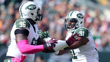 Oct 18, 2015; East Rutherford, NJ, USA; New York Jets defensive tackle Sheldon Richardson (91) celebrates with defensive end Muhammad Wilkerson (96) after a sack against Washington Redskins quarterback Kirk Cousins (not pictured) during the second quarter at MetLife Stadium. Mandatory Credit: Brad Penner-USA TODAY Sports
