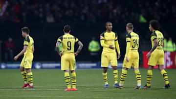 18 February 2019, Bavaria, Nürnberg: Soccer: Bundesliga, 1st FC Nuremberg - Borussia Dortmund, 22nd matchday in Max Morlock Stadium. The Dortmund players are standing on the grass after the final whistle. Photo: Daniel Karmann/dpa - IMPORTANT NOTE: In accordance with the requirements of the DFL Deutsche Fußball Liga or the DFB Deutscher Fußball-Bund, it is prohibited to use or have used photographs taken in the stadium and/or the match in the form of sequence images and/or video-like photo sequences. (Photo by Daniel Karmann/picture alliance via Getty Images)