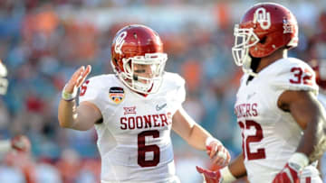 Dec 31, 2015; Miami Gardens, FL, USA; Oklahoma Sooners running back Samaje Perine (32) celebrates his touchdown with quarterback Baker Mayfield (6) during the first half of the 2015 CFP semifinal at the Orange Bowl against the Clemson Tigers at Sun Life Stadium. Mandatory Credit: Robert Duyos-USA TODAY Sports