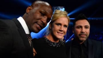 Nov 21, 2015; Las Vegas, NV, USA; Promoters and former boxing champions Bernard Hopkins (left) and Oscar De La Hoya (right) pose for a photo with UFC women