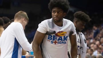 Kansas redshirt freshman guard Kyle Cuffe Jr. (5) uses crutches as he recovers from an injury during Friday's game against Southern Utah inside Allen Fieldhouse.