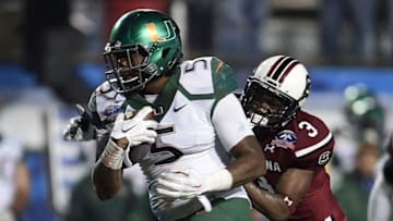 SHREVEPORT, LA - DECEMBER 27: Standish Dobard #5 of the Miami Hurricanes is pursued by Chris Lammons #3 of the South Carolina Gamecocks during the fourth quarter of the Duck Commander Independence Bowl at Independence Stadium on December 27, 2014 in Shreveport, Louisiana. (Photo by Stacy Revere/Getty Images)