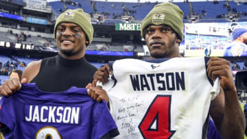 BALTIMORE, MD - NOVEMBER 17: Baltimore Ravens quarterback Lamar Jackson (R) and Houston Texans quarterback Deshaun Watson (L) hold up their traded jerseys following their game on November 17, 2019, at M&T Bank Stadium in Baltimore, MD. (Photo by Mark Goldman/Icon Sportswire via Getty Images)