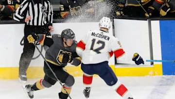 LAS VEGAS, NV - FEBRUARY 28: Vegas Golden Knights center Cody Eakin (21) skates into Florida Panthers defenseman Ian McCoshen (12) during a regular season game Thursday, Feb. 28, 2019, at T-Mobile Arena in Las Vegas, NV. (Photo by Marc Sanchez/Icon Sportswire via Getty Images)