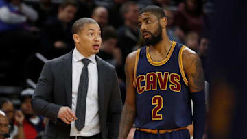 AUBURN HILLS, MI - MARCH 09: Head coach Tyronn Lue of the Cleveland Cavaliers talks with Kyrie Irving