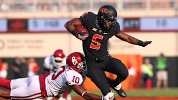 STILLWATER, OK - NOVEMBER 04: Oklahoma State Cowboys RB, Justice Hill (5) and Oklahoma Sooners DB Steven Parker (10) during a college football game between the Oklahoma Sooners and the Oklahoma State Cowboys on November 4, 2017, at the Boone Pickens Stadium in Stillwater, OK. (Photo by David Stacy/Icon Sportswire via Getty Images)