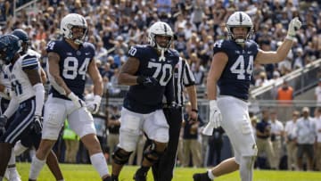 STATE COLLEGE, PA - SEPTEMBER 25: Tyler Warren #44 of the Penn State Nittany Lions celebrates after scoring a touchdown against the Villanova Wildcats during the second half at Beaver Stadium on September 25, 2021 in State College, Pennsylvania. (Photo by Scott Taetsch/Getty Images)
