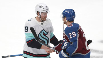DENVER, COLORADO - APRIL 30: Ryan Donato #9 of the Seattle Kraken is congratulated by Nathan MacKinnon #29 of the Colorado Avalanche after their 2-1 loss in Game Seven of the First Round of the 2023 Stanley Cup Playoffs at Ball Arena on April 30, 2023 in Denver, Colorado. (Photo by Matthew Stockman/Getty Images)