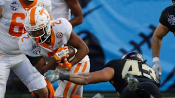 Tennessee running back Jabari Small (2) finds a line through the Purdue defense during the 2021 TransPerfect Music City Bowl between Tennessee and Purdue at Nissan Stadium in Nashville, Tenn., on Thursday, Dec. 30, 2021.Hpt Music City Bowl First Half 02