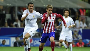 Real Madrid's Portuguese forward Cristiano Ronaldo (L) fights for the ball with Atletico Madrid's French forward Antoine Griezmann during the UEFA Champions League final football match between Real Madrid and Atletico Madrid at San Siro Stadium in Milan, on May 28, 2016. / AFP / OLIVIER MORIN (Photo credit should read OLIVIER MORIN/AFP/Getty Images)