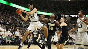 EAST LANSING, MICHIGAN - JANUARY 08: Kenny Goins #25 of the Michigan State Spartans grabs a first half rebound next to Trevion Williams #50 of the Purdue Boilermakers at Breslin Center on January 08, 2019 in East Lansing, Michigan. (Photo by Gregory Shamus/Getty Images)