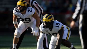 Nov 2, 2019; College Park, MD, USA; Michigan Wolverines defensive lineman Kwity Paye (19), possible 2021 NFL Draft target of the Los Angeles Chargers, and linebacker Jordan Glasgow (29) prior to the snap during the 2g against the Maryland Terrapins at Capital One Field at Maryland Stadium. Mandatory Credit: Tommy Gilligan-USA TODAY Sports