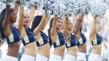 LOS ANGELES, CA - AUGUST 12: The Rams Cheerleaders stand on the field prior to the start of the preseason game between the Los Angeles Rams and the Dallas Cowboys at the Los Angeles Memorial Coliseum on August 12, 2017 in Los Angeles, California. (Photo by Josh Lefkowitz/Getty Images)