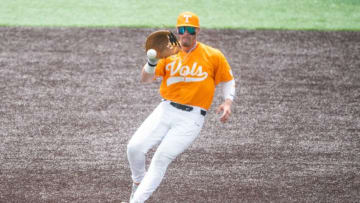 Tennessee first baseman Blake Burke (25) fields the ball during a college baseball game between Tennessee and Kentucky at Lindsey Nelson Stadium in Knoxville, Tenn., on Saturday, May 13, 2023.