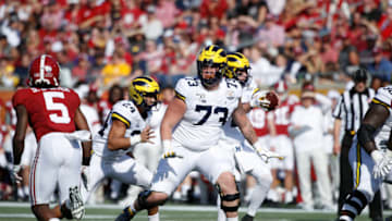 ORLANDO, FL - JANUARY 01: Jalen Mayfield #73 of the Michigan Wolverines blocks during the Vrbo Citrus Bowl against the Alabama Crimson Tide at Camping World Stadium on January 1, 2020 in Orlando, Florida. Alabama defeated Michigan 35-16. (Photo by Joe Robbins/Getty Images)