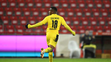 Youssoufa Moukoko celebrates after scoring his first senior goal for Borussia Dortmund (Photo by Annegret Hilse - Pool/Getty Images)