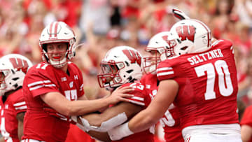 MADISON, WISCONSIN - SEPTEMBER 07: Jonathan Taylor #23 of the Wisconsin Badgers celebrates with Jack Coan #17 and Josh Seltzner #70 after scoring a touchdown in the second quarter against the Central Michigan Chippewas at Camp Randall Stadium on September 07, 2019 in Madison, Wisconsin. (Photo by Dylan Buell/Getty Images)