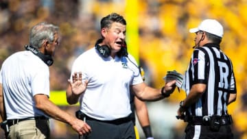 Iowa head coach Kirk Ferentz, left, and Iowa offensive coordinator and quarterbacks coach Brian Ferentz argue a call