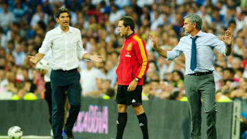 MADRID, SPAIN - AUGUST 19: head coach Jose Mourinho (R) of Real Madrid argues with head coach Mauricio Pellegrino of Valencia during the La Liga match between Real madrid and Valencia at Estadio Santiago Bernabeu on August 19, 2012 in Madrid, Spain. (Photo by Gonzalo Arroyo Moreno/Getty Images)