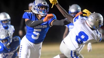 Highland Home's Jakaleb Faulk (5) blocks against Clarke County's Jarrad Robinson (8) during their playoff game on the Highland Home campus in Highland Home, Ala. on Friday evening November 18, 2022.Hh18