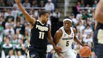 EAST LANSING, MI - FEBRUARY 10: Cassius Winston #5 of the Michigan State Spartans handles the ball while defended by P.J. Thompson #11 of the Purdue Boilermakers at Breslin Center on February 10, 2018 in East Lansing, Michigan. (Photo by Rey Del Rio/Getty Images)
